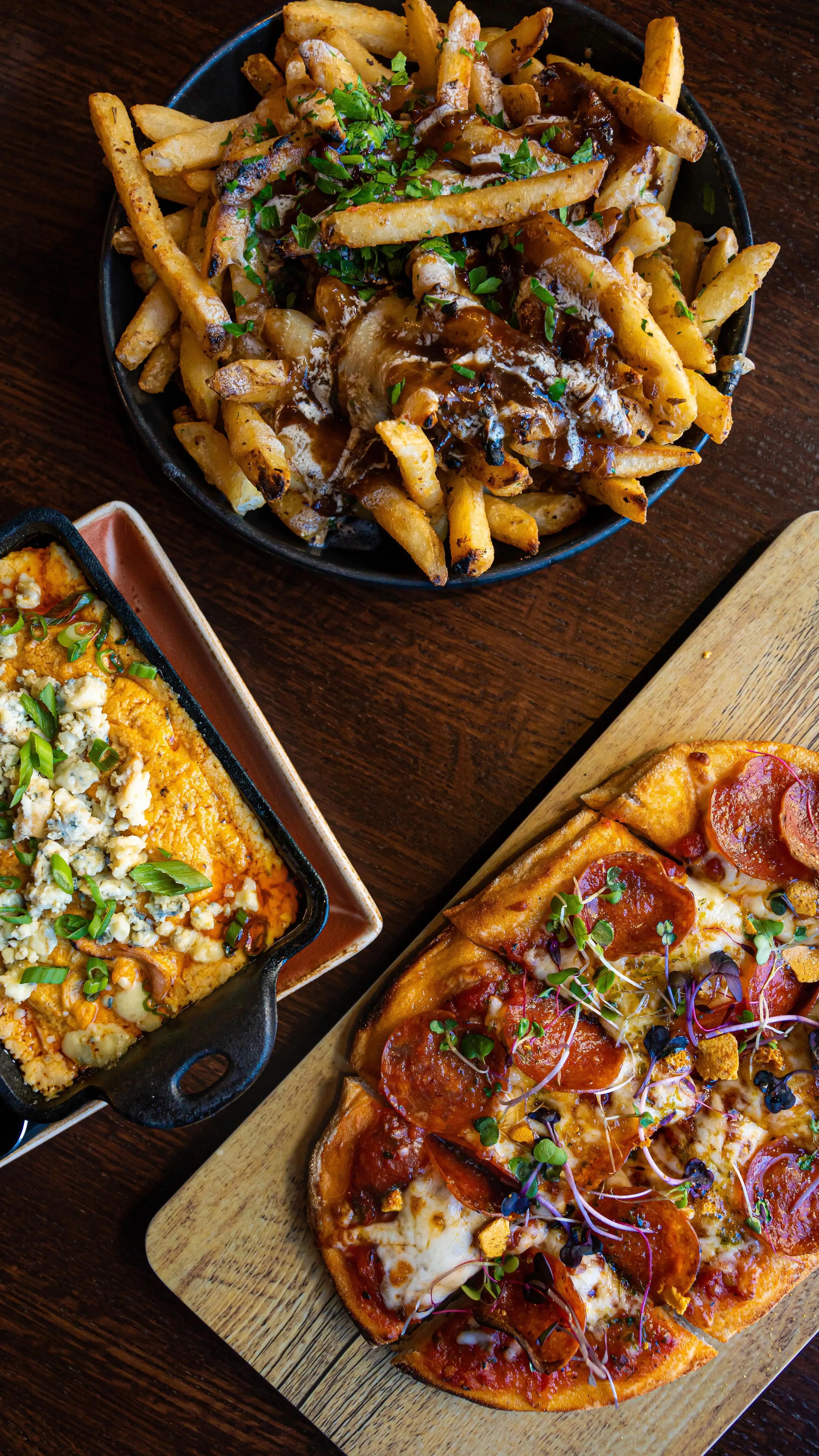 Flatbread, Poutine, and Buffalo Chicken Dip from Puttshack