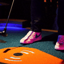 GIF of people setting their balls up at the start