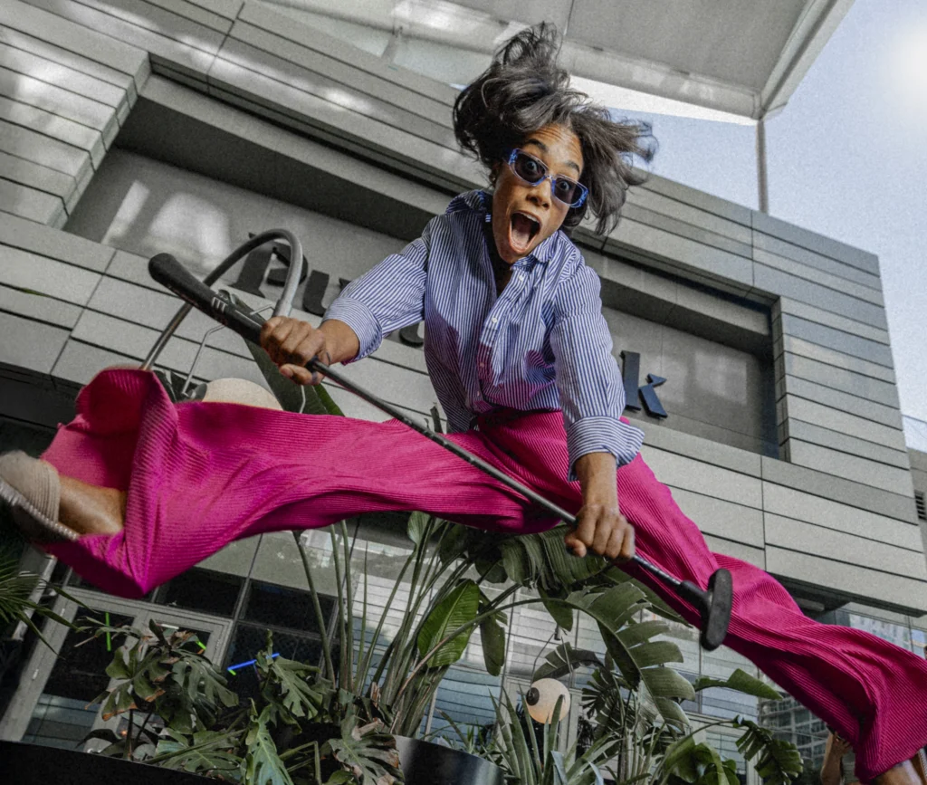 woman jumping, excited to mini golf
