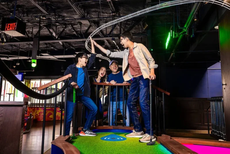 two boys on a course high fiving