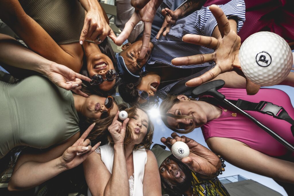 a group of friends looking down at the camera