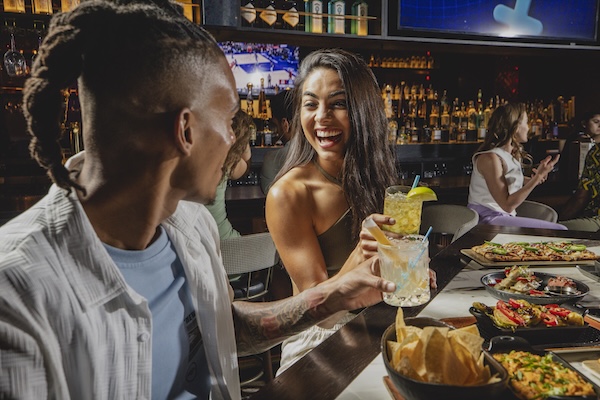 woman at happy hour with cocktail